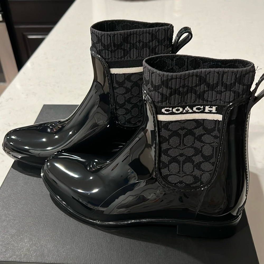 Brand new Coach black boots.